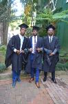 Three gentlemen dressed to the nines for graduation