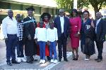 Acting DVC Humanities Professor Stephen Mutula seen with his students and their families
