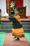 A proud family member dances her pride at graduation