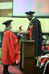 Professor Rob Slotow recieves his fellowship from Dr Zweli Mkhize