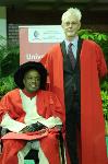 Optom academic, Dr Percy Mashige, is congratulated by his colleague Professor Johan Van Heerden