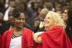 A lighthearted moment between PhD graduates